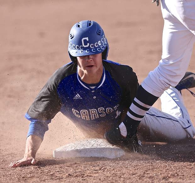 Carson&#039;s Brandon Gagnon belly-slides into third base during a playoff win against Damonte last season.