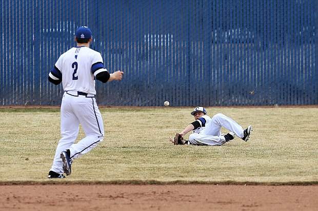 Joe Tonino makes a diving attempt to catch a flyball for Carson on Friday.