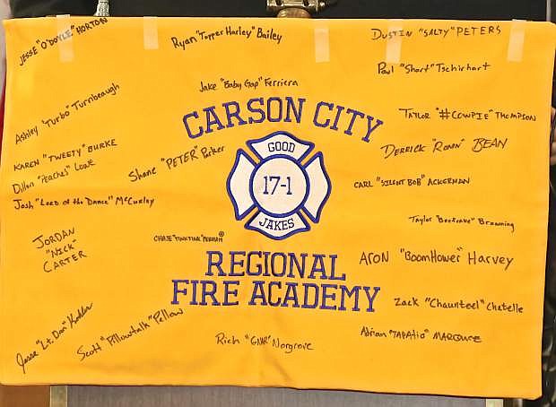 A small banner hung on the podium with all of the graduates signatures and nicknames Friday night at the Nugget.