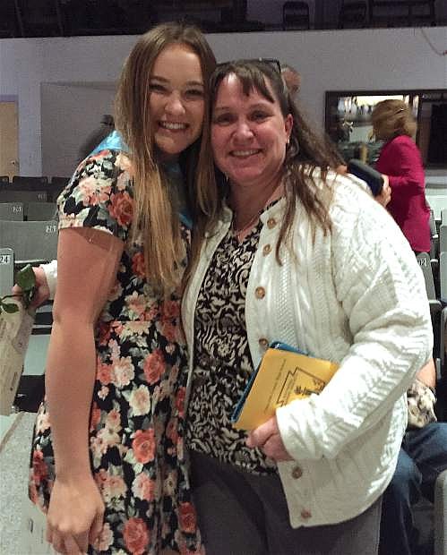 CCHS senior and National Honor Society inductee Stacy Kalt embraces one of her favorite teachers, pre-calculus instructor Elena Marsh.