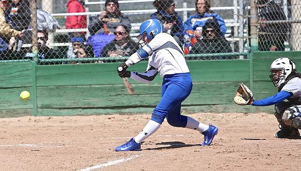 Junior Nicole Brown raps a double in the first inning against the Newark Memorial Cougars Friday in Sparks.