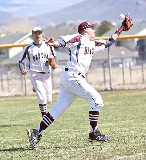 Dustdevil 2nd baseman Zach Woitas juggles the ball before bringing it in for an out Saturday against Spring Creek.