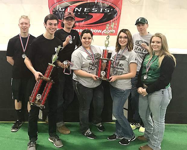 Members of the Churchill County archery club show off their awards after winning third in the state archery tournament. Left to right are Koda Biggs, Broder Thurston, Sterling Lee, Emily Dixon, Lana Quint, Cody Sponsler and Sienna Burgess.