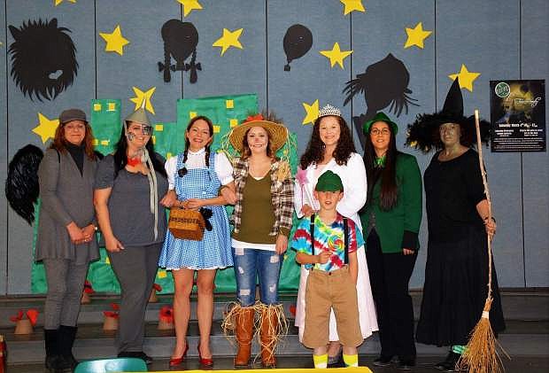 Cast of Wizard of Oz was staff from Financial Horizons Credit Union and the Lahontan PTO president and her son. Back row from left are Sue Payne, Tiffany Deboer, Angela Guthrie, Erica Smith, Andrea Cavanaugh, Cynthia Frank , Sheila Washington. Front Row is Liam Few.