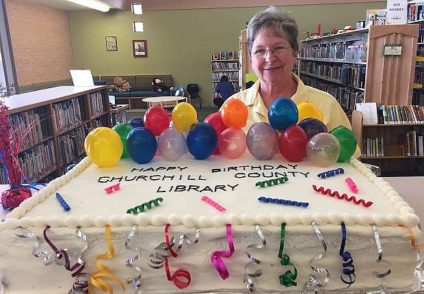 Churchill County Library celebrates its special birthday with a cake by Cheryl Scherschel (pictured) that included edible balloons.