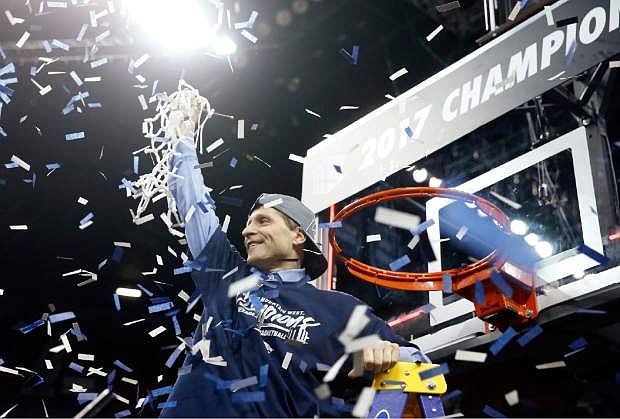 Nevada coach Eric Musselman cuts the net after Nevada defeated Colorado State 79-71 for the Mountain West Conference tournament championship Saturday in Las Vegas.