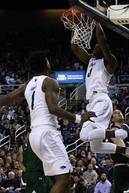 Nevada&#039;s Cameron Oliver dunks against Colorado State in the second half while Marcus Marshall (1) watches.