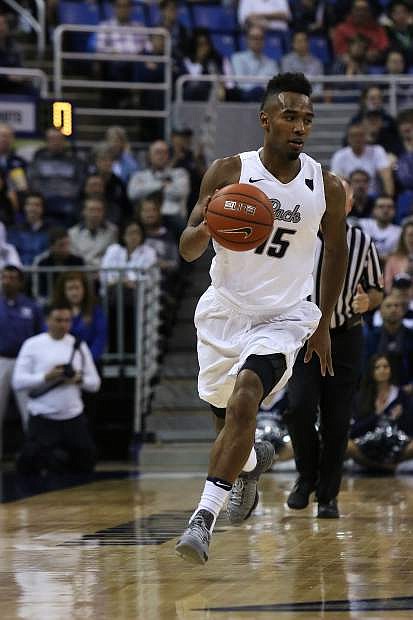 D.J. Fenner brings the ball up the court for Nevada earlier this season.