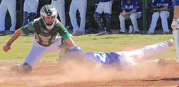 Fallon catcher Brock Uptain tags out South Tahoe&#039;s Garret Harley at the plate in Friday&#039;s first game of a doubleheader.