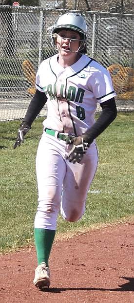 Kayla Buckmaster runs into home plate during the Lady Wave&#039;s home series against Elko.