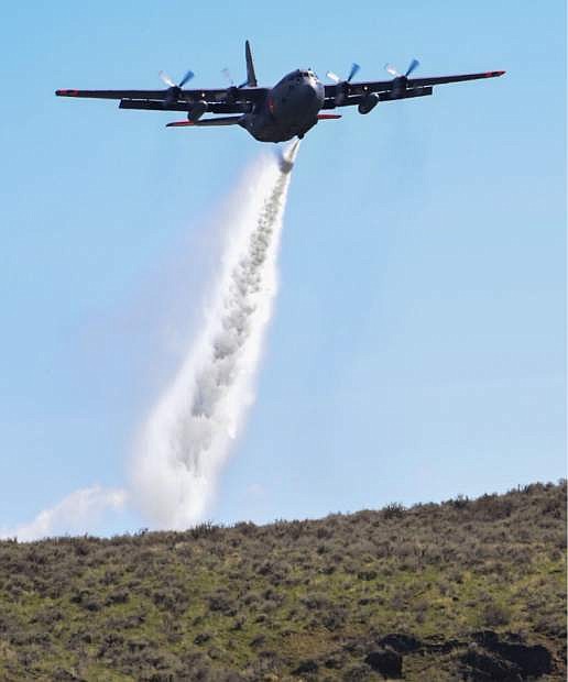 A C130 aircraft is loaded with the MAFFS (Modular Airborne Fire Fighting System).