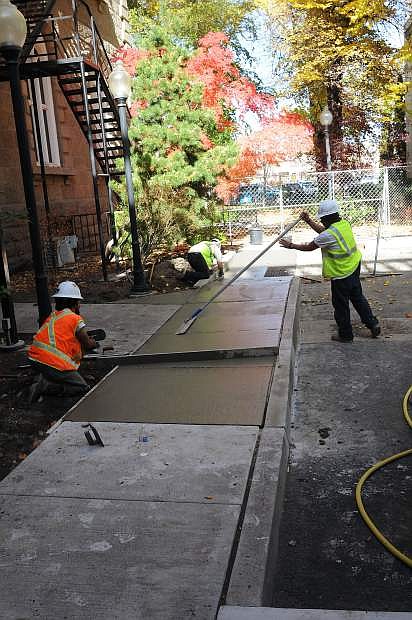 Workers continue to work on an ADA compliant ramp to enter the Capitol building in Carson City in the file photo. The ramp was completed Monday.