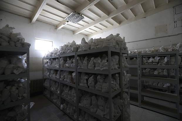In this picture taken on Wednesday, March 22, 2017, bags with processed ore samples containing lithium are placed in a storage room of Geomet company in the village of Dubi, Czech Republic. Geomet explored and confirmed large deposits of Lithium near the village of Cinovec. An expected massive surge in demand for this metal means a revival of centuries-long mining tradition in the area. (AP Photo/Petr David Josek)