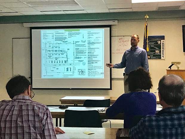 Douglas County Engineer Erik Nilssen presents a master drainage plan during the alluvial fan flooding workshop Wednesday.
