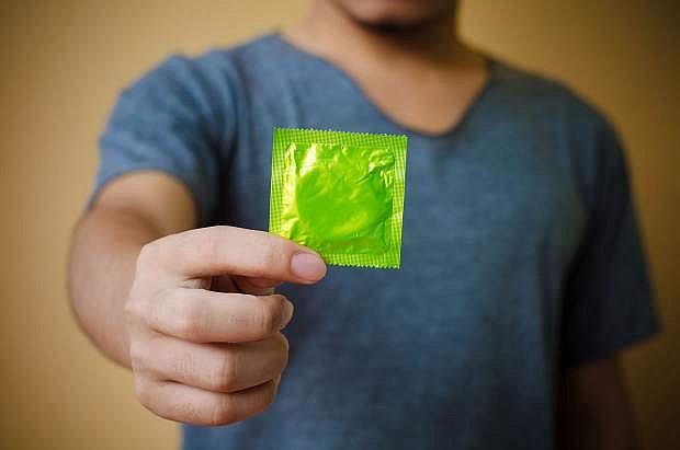 hand holding condom