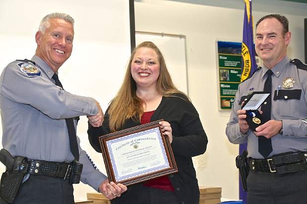 Not only were NHP Troopers given awards for their service, two dispatchers, including Jennifer McCauley (center) were recognized Wednesday, pictured here with Col. Dennis Osborn and Lt. Col. John O&#039;Rourke.