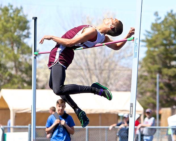 Dayton&#039;s J.J. Ply attempts 7-feet in the boys varsity high jump event Saturday at Reed High School.