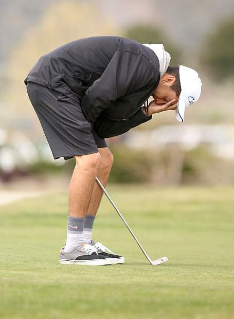 Lakoda Smokey reacts to a missed putt on the second green at Genoa Lakes Golf Course on Tuesday.