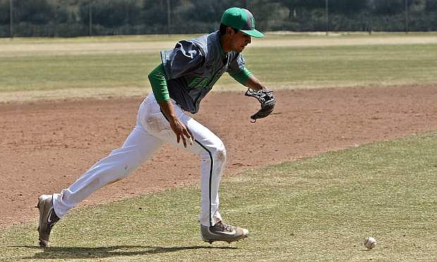 Alex Mendez makes a bare handed play on the ball at third base against Spring Creek on April 1.