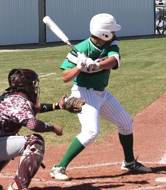 Edgar Alvarado, 21, prepares for a pitch during the Greenwave&#039;s game against Elko.