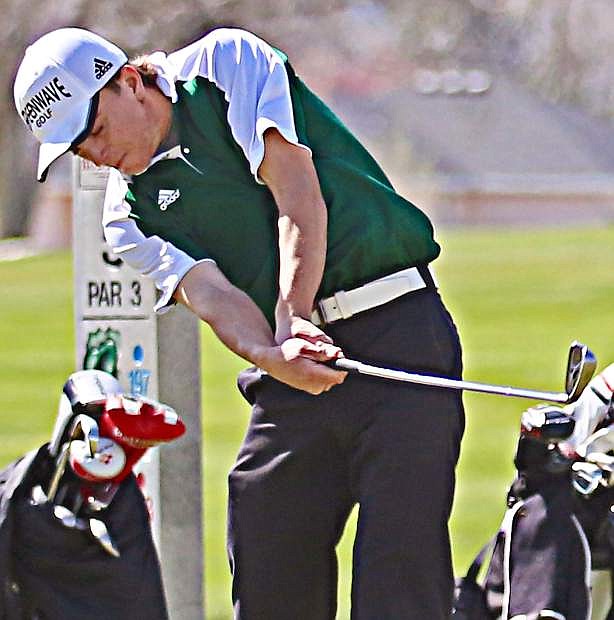Kelvin Cann swings for his shot during a golf tournament in Elko.