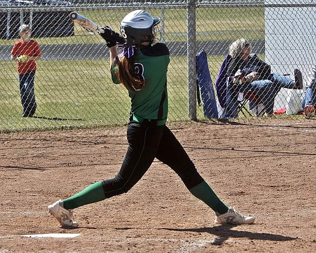 Kayla Buckmaster takes a hard swing at a pitch during one of the Lady Wave&#039;s games in Spring Creek.