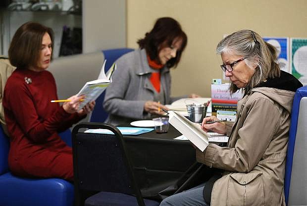 From left, Gail Herstead, Linda Bellegray, and Candace Stowell enjoy a Book Tasting at the Carson City Library, in Carson City, Nev., on Friday, April 7, 2017. The Carson City Friends of the Library provided wine and appetizers for the event promoting the Capital City Reads program. For more information about upcoming events at the library, go to carsoncitylibrary.org. Photo by Cathleen Allison/Nevada Photo Source
