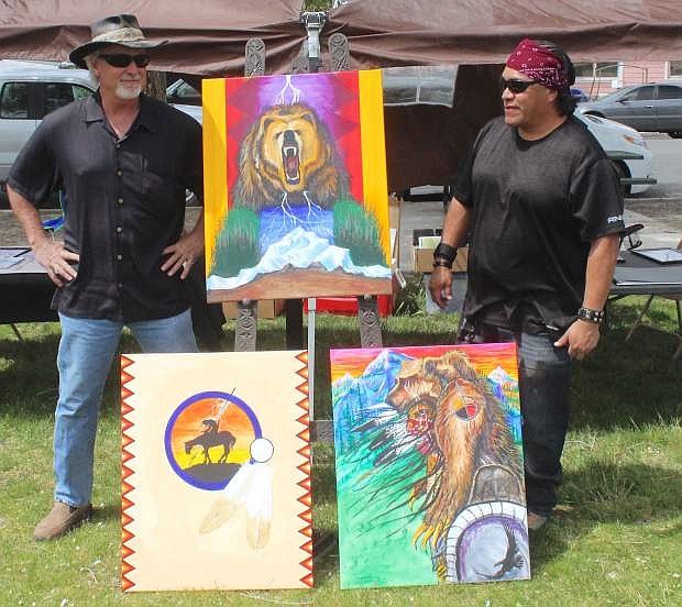 Marvin &quot;Black Eagle&quot; Phoenix, right displays his artwork with Kevin Bodecker.
