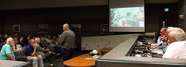 Incident Commander Bill Lawry addresses a town hall meeting on Tuesday to discuss flood preparations for Churchill County.