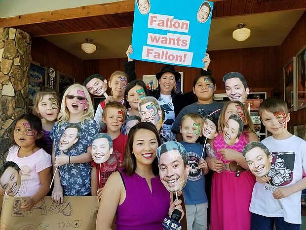 Ivy Land children and staff as well as KRNV 4 reporter Diane Thao show their support for #FallonWantsFallon on Friday in downtown Fallon.