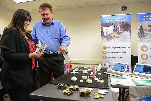 Pavel Solin, founder and CEO of NCLab, talks about coding skills and 3D printers with Nevada Assembly employee Patricia Demsky. Library representatives from around the state met with lawmakers to raise awareness about issues facing state libraries as part of Nevada Library Day.