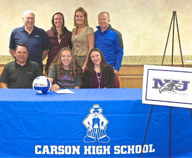 CHS senior Jaycie Roberts, center, signs her national letter of intent to play volleyball at Niagra University in Lewiston, New York. Here she is pictured with her parents Brandon and Mia Roberts (seated) and her coaches (L-R, standing) Mike Williams, Jordan Reeder, Erin Been and Robert Maw.