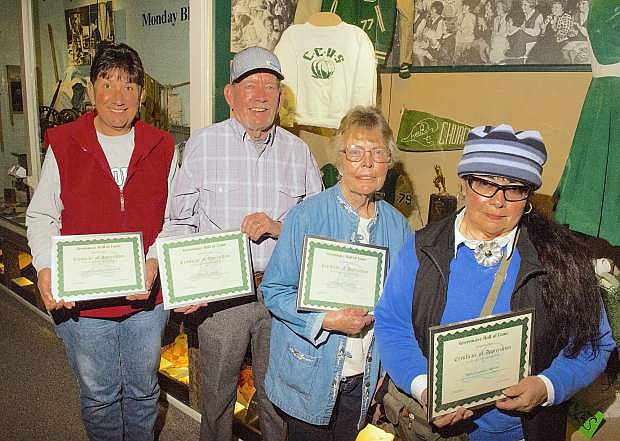 Yvonne Arciniega Sutherland (from left), Dave Lumos, Bunny Corkill and Nancy Sanders Stewart spent several months going through yearbooks, newspapers and anything else they could find in researching Churchill County High School athletics at the county museum. They presented information to the Greenwave Hall of Fame in March that spans from the early 1900s through the 1950s.