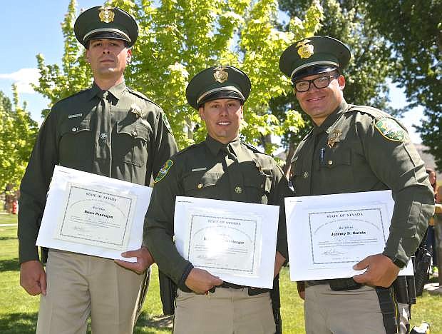 New CCSO deputies Bruce Pendragon, Daniel Henneberger and Jeremy Garcia pose for a photo following graduation Thursday.