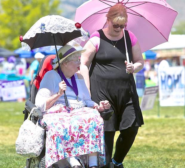 Dolores Jackson of Carson City rolls around the Relay For Life course with Sharon Daniels Saturday.