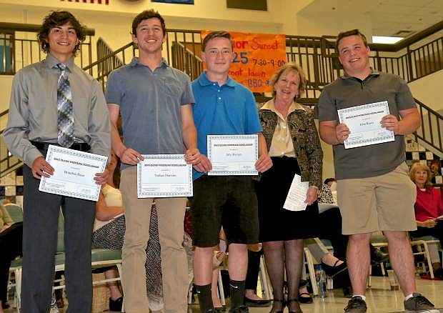 Brandon Basa, Nathan Mersino, Jake Roman and John Rowe receive the CHS Wrestling Boosters Bing Blood Memorial Scholarship as presented by Stella Blood Thursday at Carson High.