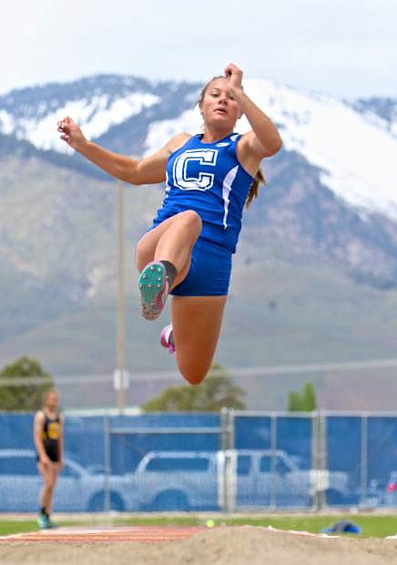 Carson&#039;s Abbey Paulson launches in the girls long jump event Saturday.