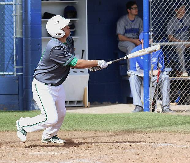 Fallon catcher Edgar Alvarado hits his second home run of the game against McQueen in Fallon&#039;s only win of the Mike Bearman Memorial Tournament in Sparks.