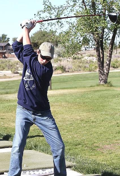 Ray Plaase prepares for a swing at the Fallon Golf Course.