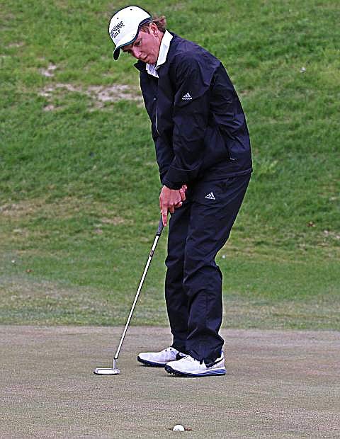Kelvin Cann putts the ball to the hole at Spring Creek golf course.