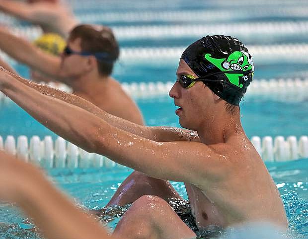 Kendall Rogers leads off for the Greenwave in the 3A state 200 medley relay event Saturday at the Carson City Aquatic Center.