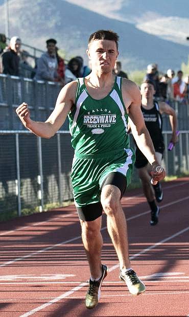 Fallon&#039;s Colton Peterson pumps his fist after crossing the finish line as the 4x100-meter relay team wins to qualify for state.