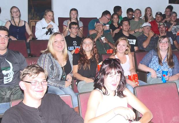 Churchill County High School graduates watch a movie at Fallon Theatres Wednesday night.