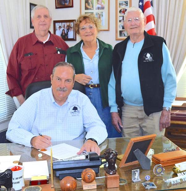 Mayor Ken Tedford signs a proclamation for the National Day of Prayer, which will be recognized in Fallon on May 4. In the back row from left are Floyd Rathbun; Lynn Wallace Kinsell, Ph.D, Nevada State Regent, Daughters of the American Revolution; and John Tewell, retired councilman.