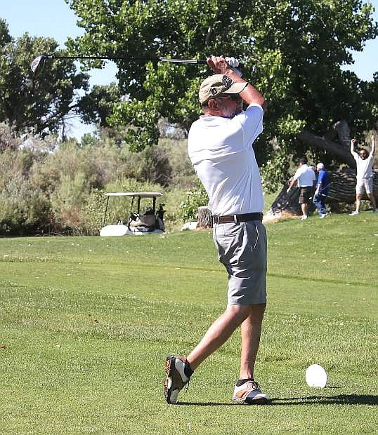 Charlie Arciniega tees off at one of the holes of the Fallon Golf Course.