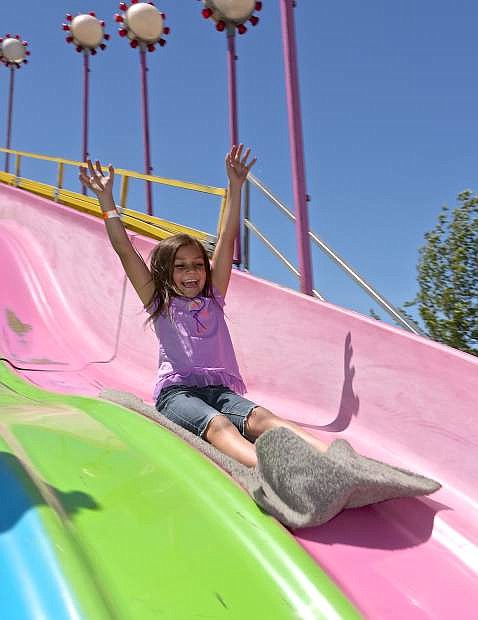 Julie Salanoa slides down the big slide at the Nevada State Fair during last year&#039;s fair.