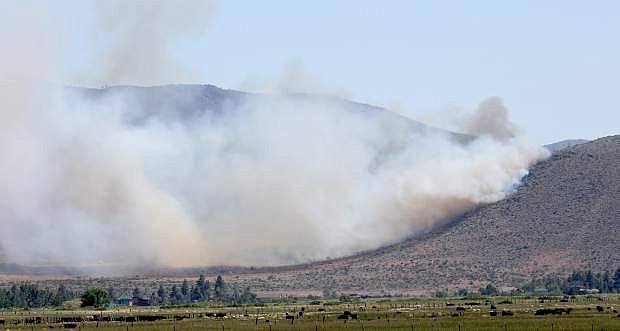 Smoke spreads from a wildland fire in south Carson Valley on Tuesday.