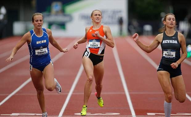 UC Santa Barbara&#039;s Tori Usgaard, left, Oregon State&#039;s Kara Hallock, center, and Nevada&#039;s Nicole Wadden, right, cross the finish line in a heat of the heptathlon 200 meters on the third day of the NCAA outdoor college track and field championships in Eugene, Ore., Friday, June 9, 2017. (AP Photo/Timothy J. Gonzalez)