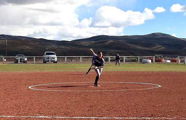 Oasis Academy&#039;s pitcher lines up a shot to the plate during a 2016-17 softball game.