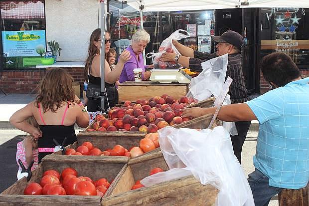 The East Center Farmers Market has vendors selling fresh produce.